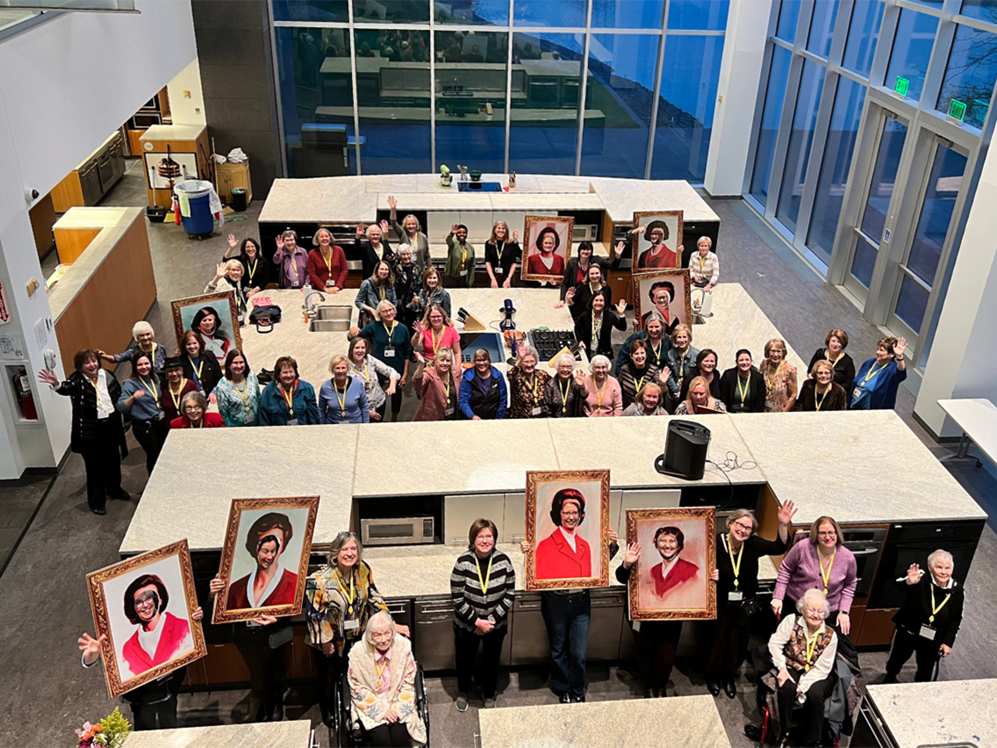 Women who have worked on Betty Crocker pose for a photo in the Betty Crocker Kitchens